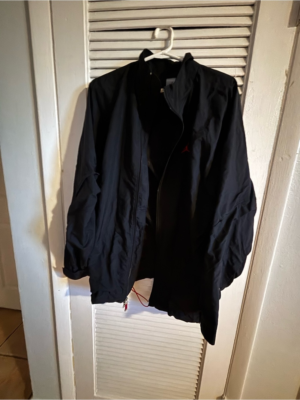 Jordan Men's Black Windbreaker Jacket with Subtle Red Logo